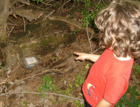Child points out cache.