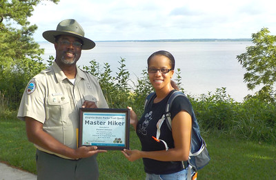 Master Hiker Gaylynn Johnson receiving her certificate from York River Park Manager John Grisham