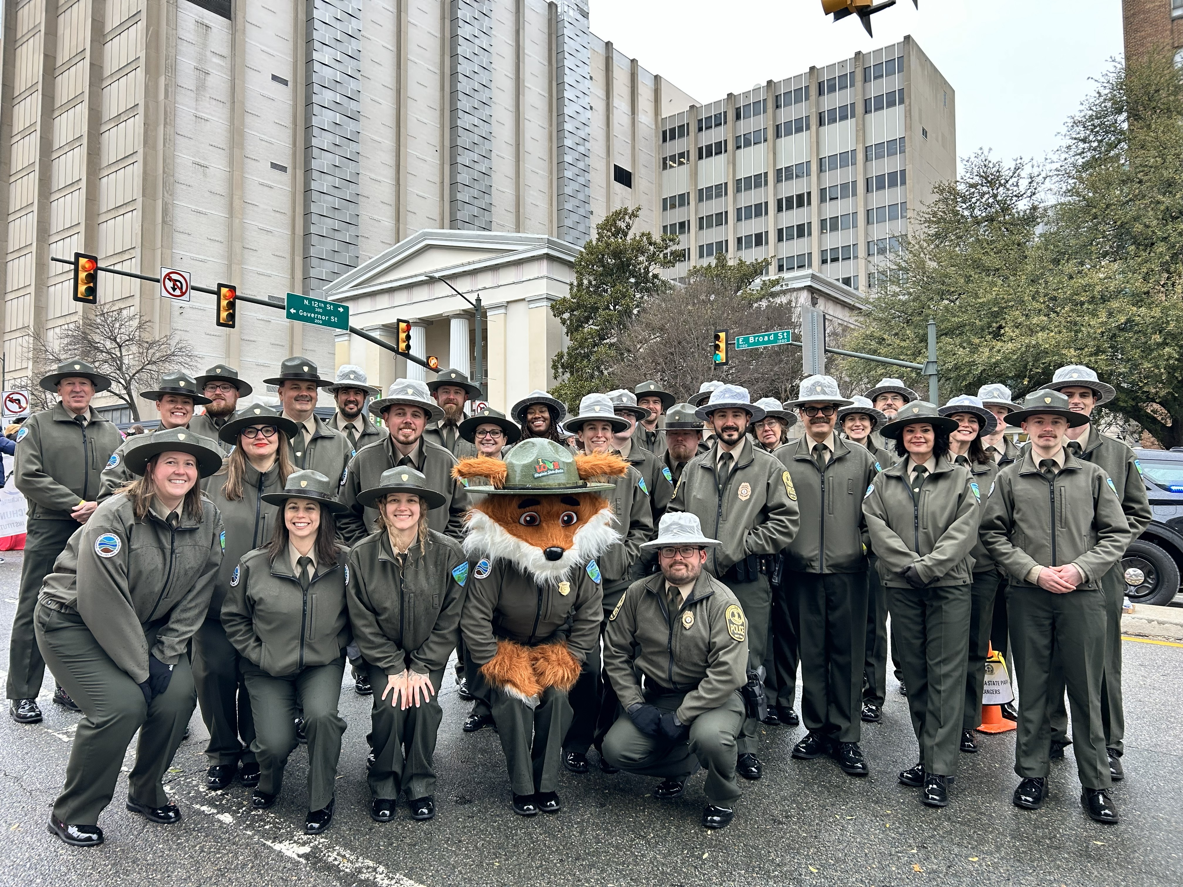 Park Rangers pose along the parade route on inauguration day for Virginia's 75th Governor Abigail Spanberger.