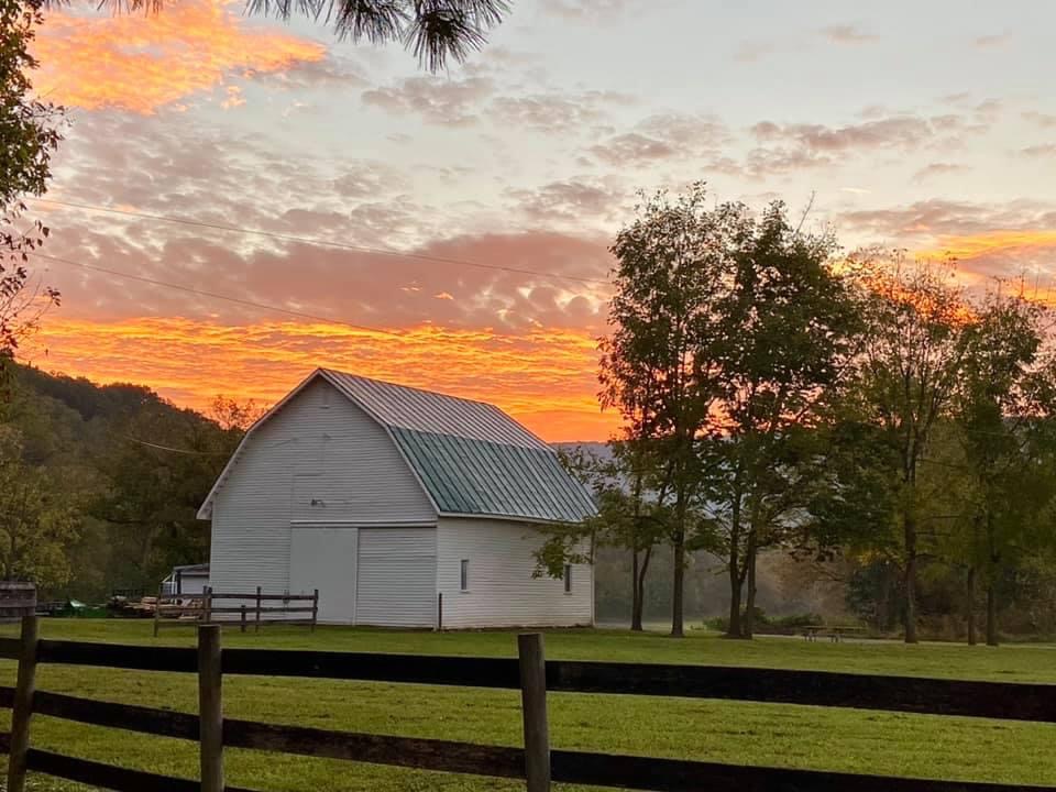 Sunrise on a farm with a barn