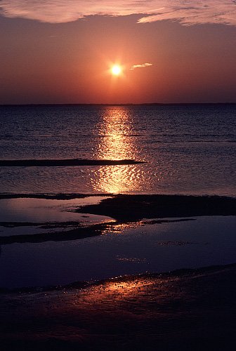 photo of bayside beach and sunset