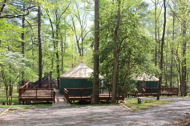 Yurts at Fairy Stone State Park with parking spaces.