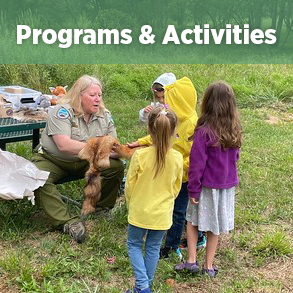 ranger teaching kids about animal furs