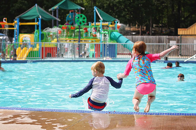 Kids jump into the pool at Pocahontas State park