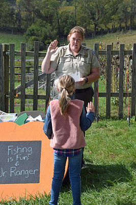 Park ranger swearing in a Junior Ranger at Sky Meadows State Park
