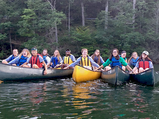 crew members enjoying a canoeing trip
